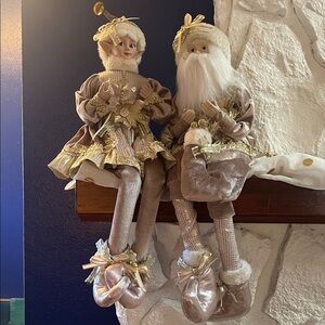 Elegant Holiday Santa and Mrs. Claus Figurines chimney decorations.